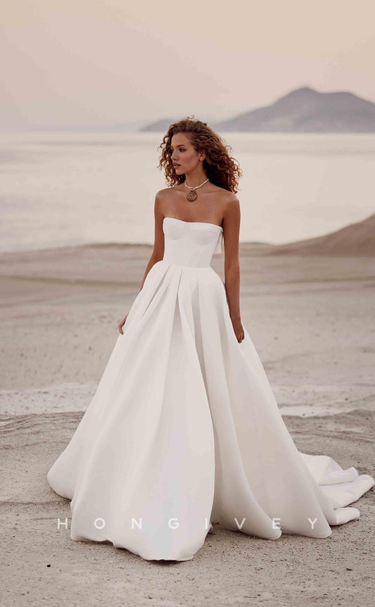 H0849 - Simple Strapless Cutout With Bow Detail And Train Beach Wedding Dress