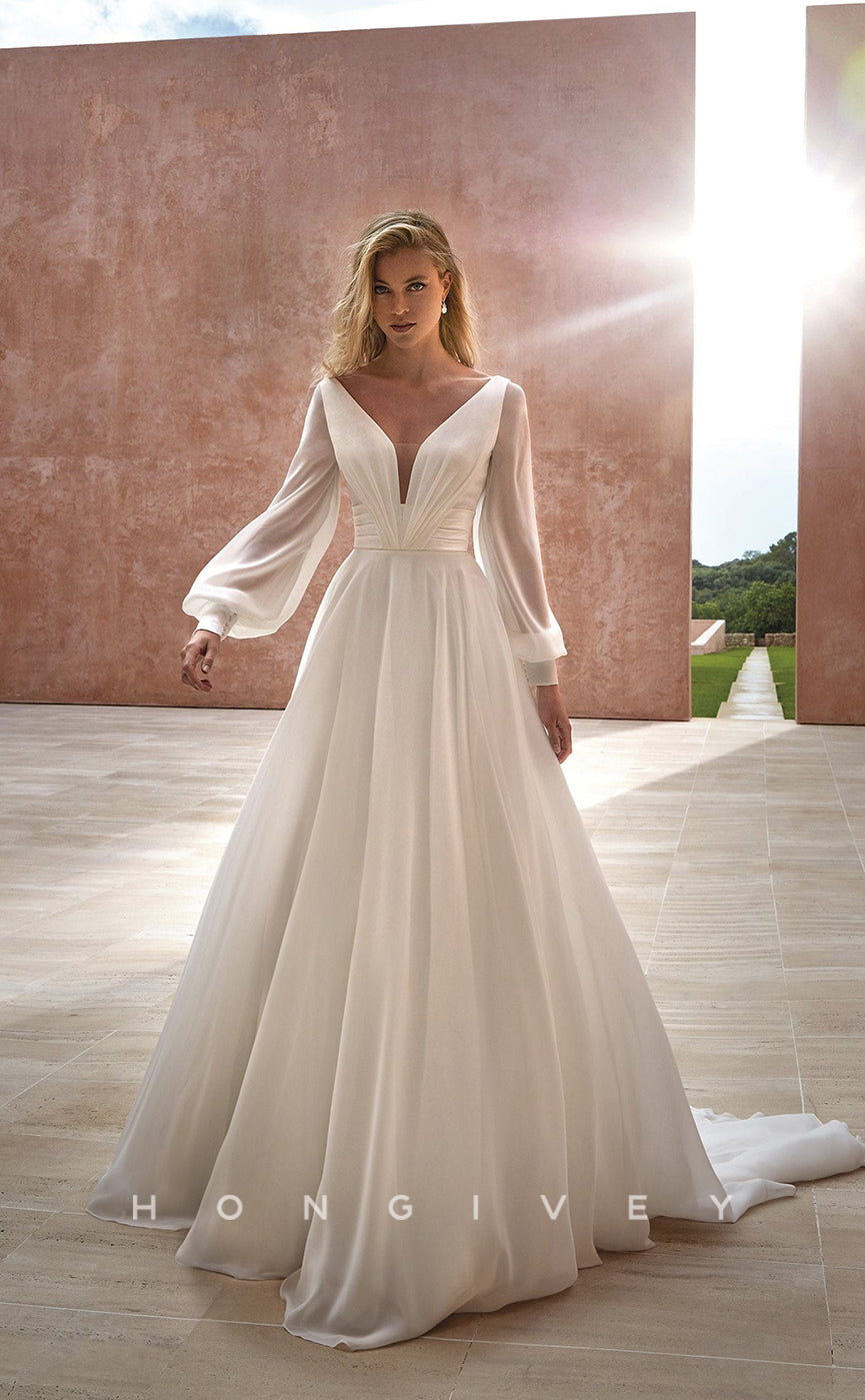 H0871 - Sheer Plunging Illusion Open Back Ruched Long Sleeve With Train Wedding Dress