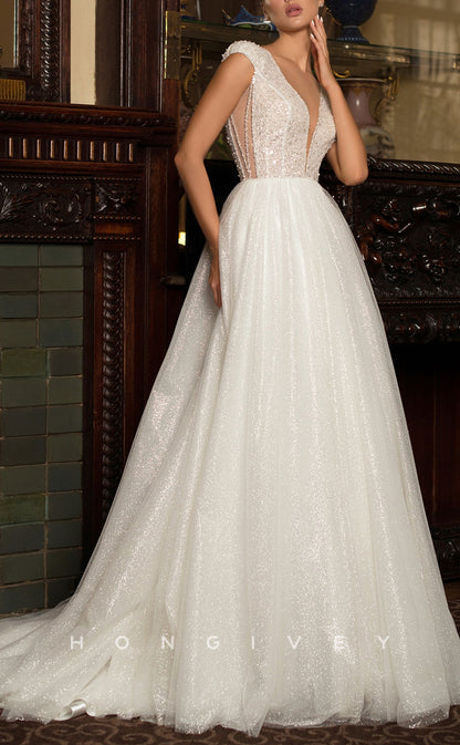 H1029 - Ornate Glitter Plunging Neck Cap Sleeves Beaded Long Wedding Dress