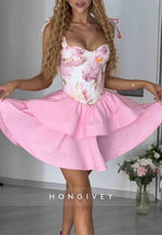 Pink A-Line Floral Print Crisscross Back Short Homecoming Dress with Bowknots